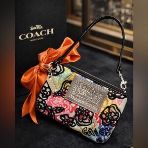 COACH Poppy Wristlet with Metal Hang Tag